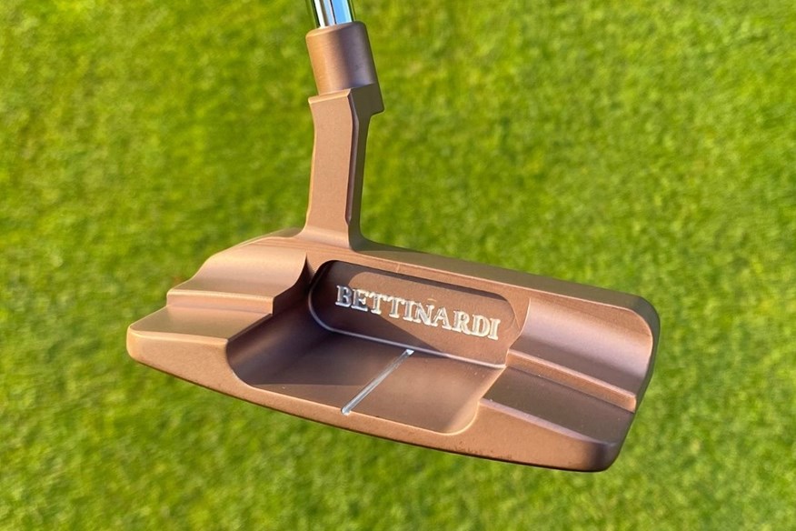 The Royal Rose PVD finish of the Bettinardi Queen B 8 putter is very striking
