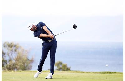 Dustin Johnson smokes his driver.