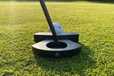 The L.A.B. Golf DF3 putter sits well behind the ball